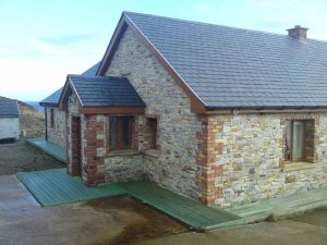 Stone house with brick corners